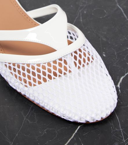 Alaïa Mules Infradito en cuir et résille - Alaia - Modalova