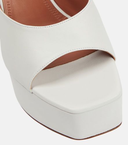 Mules à plateau Dalida en cuir - Amina Muaddi - Modalova