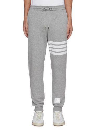 Bar stripe elastic drawstring waist jogging pants - THOM BROWNE - Modalova