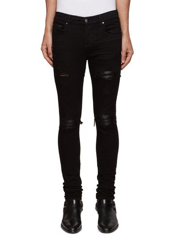 MX1 PERMANENT UNWASHED HEAVILY DISTRESSED LINED SKINNY JEANS - AMIRI - Modalova