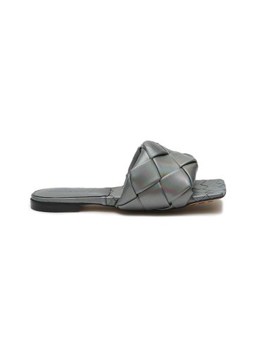 Lido' intreccio laser leather flat sandals - BOTTEGA VENETA - Modalova
