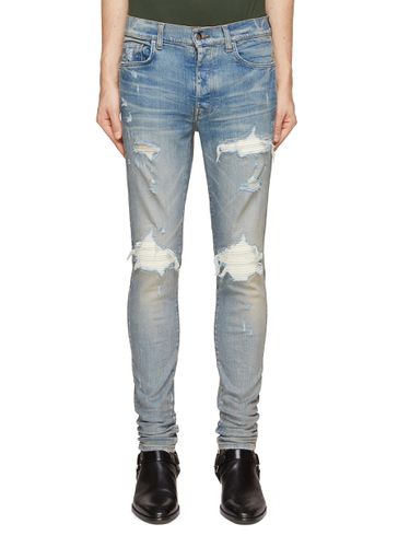 ‘32' MX1' SUEDE INSERT DISTRESSED DETAIL SKINNY JEANS - AMIRI - Modalova