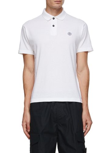 Logo Patch Dyed Cotton Polo Shirt - STONE ISLAND - Modalova