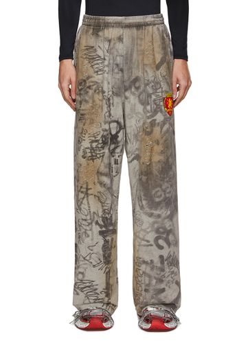 All Over Graffiti Print Ripped Baggy Sweatpants - BALENCIAGA - Modalova