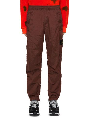 Nylon Pants - STONE ISLAND - Modalova