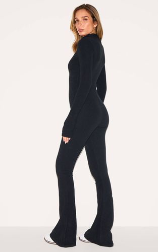 Black Combinaison Côtelée Avec Détail Zip Et Passe-pouces | Taille 32 - PrettyLittleThing - Modalova