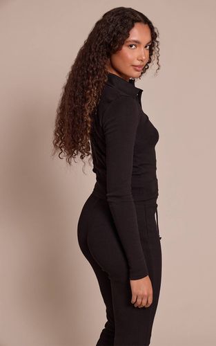 Black Haut Côtelé À Col Et Manches Longues Pour Grande Taille | Taille 42 - PrettyLittleThing - Modalova