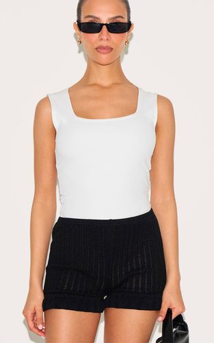 Black Short Mini En Maille À Volants Petite | Taille Small - PrettyLittleThing - Modalova