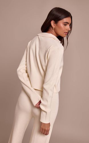 Cream Synthétiquell En Maille Côtelée À Manches Longues Et Col En V | Taille Large - PrettyLittleThing - Modalova