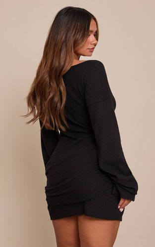 Black Robe Mini Moulante En Maille Côtelée Brossée Col Bateau Avec Taille Cache-cœur | Taille 36 - PrettyLittleThing - Modalova