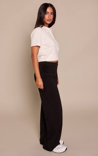 Black Pantalon Petite Taille Large À Taille Repliée Et Liens Latéraux | Taille 34 - PrettyLittleThing - Modalova