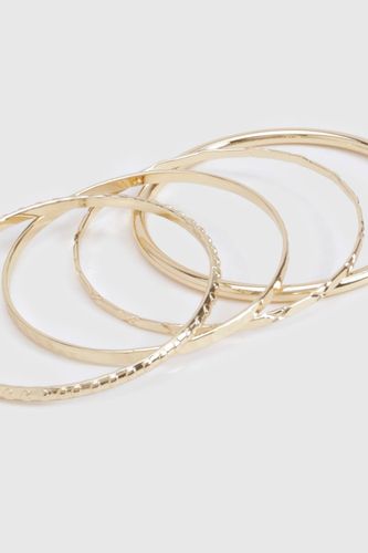 Pack de 4 bracelets gaufrés - boohoo - Modalova