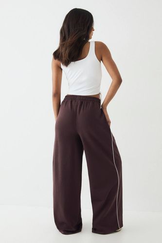 Jogging à Jambes Larges Taille Moyenne avec Détails de Passepoil | Taille Large - DSGN Studio - Modalova