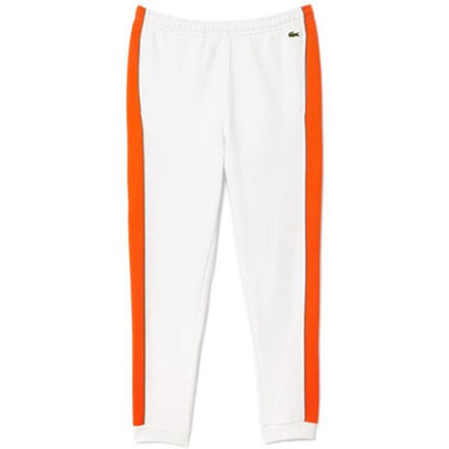 Pantalon PANTALON DE SURVÊTEMENT COLOR-BLOCK ET ORANGE - Lacoste - Modalova