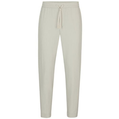 Pantalon CHINO T-FLEX TAPERED FIT EN TISSU STRETCH DÉPERLANT BEI - BOSS - Modalova