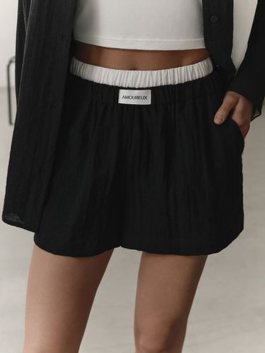 Loose shorts with contrasting waistband - Lichi - Modalova